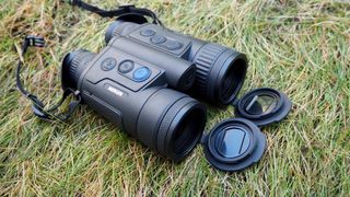 Pulsar Merger LRF XP35 binoculars on a grassy surface