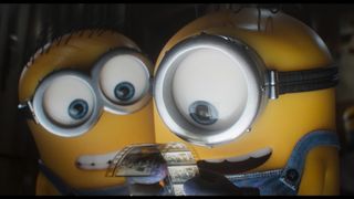 Minions look at a film reel in Minions & Monsters.