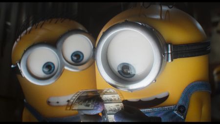 Minions look at a film reel in Minions & Monsters.