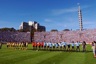 The teams line up before the first leg of the 2006 World Cup qualification play-off between Uruguay and Australia in Montevideo