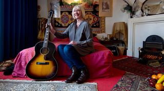 Former girlfriend of Jimi Hendrix Kathy Etchingham poses for a photograph in a recreation of his bedroom as it is displayed at the Handel and Hendrix exhibition on February 8, 2016 in London, England. The permanent exhibtion in the former London home of Jimi Hendrix celebrates the lives of Jimi Hendrix and George Frideric Handel who also lived in the property in the 1700s.