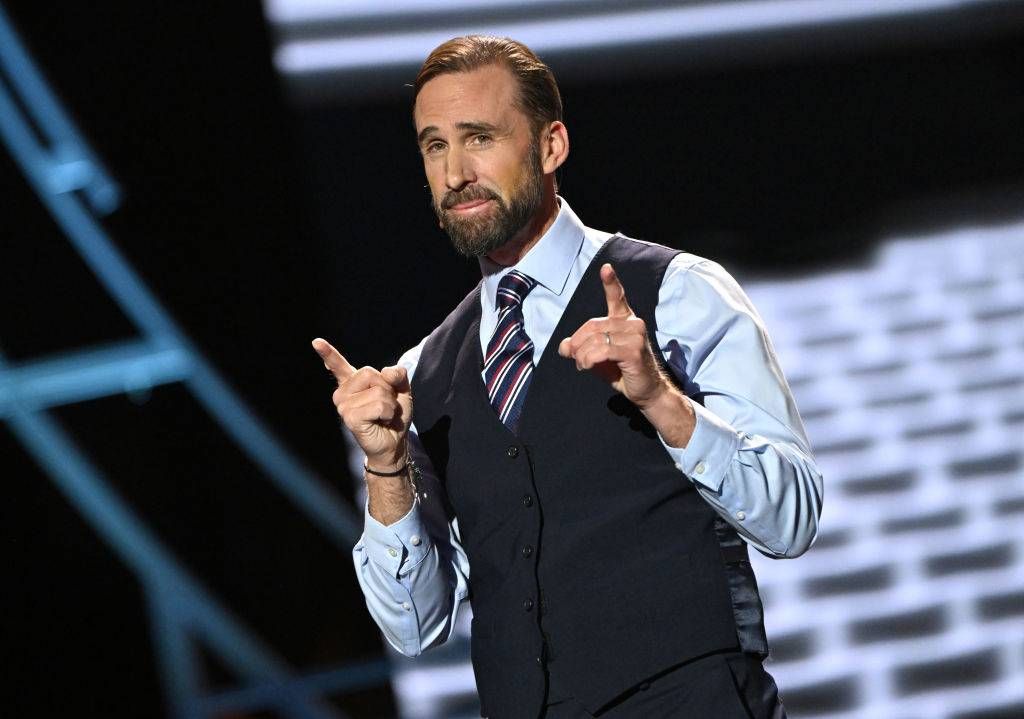 Joseph Fiennes performing on stage as Gareth Southgate during The Olivier Awards 2024 at The Royal Albert Hall