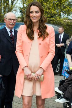 Kate Middleton wearing a peach-coloured coat