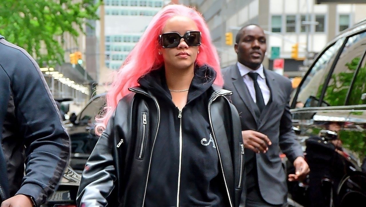 Rihanna departs for the Miami Grand Prix with pink hair while wearing an oversize sweatsuit