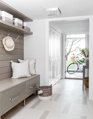 mudroom ideas with shiplap walls and beige cupboards