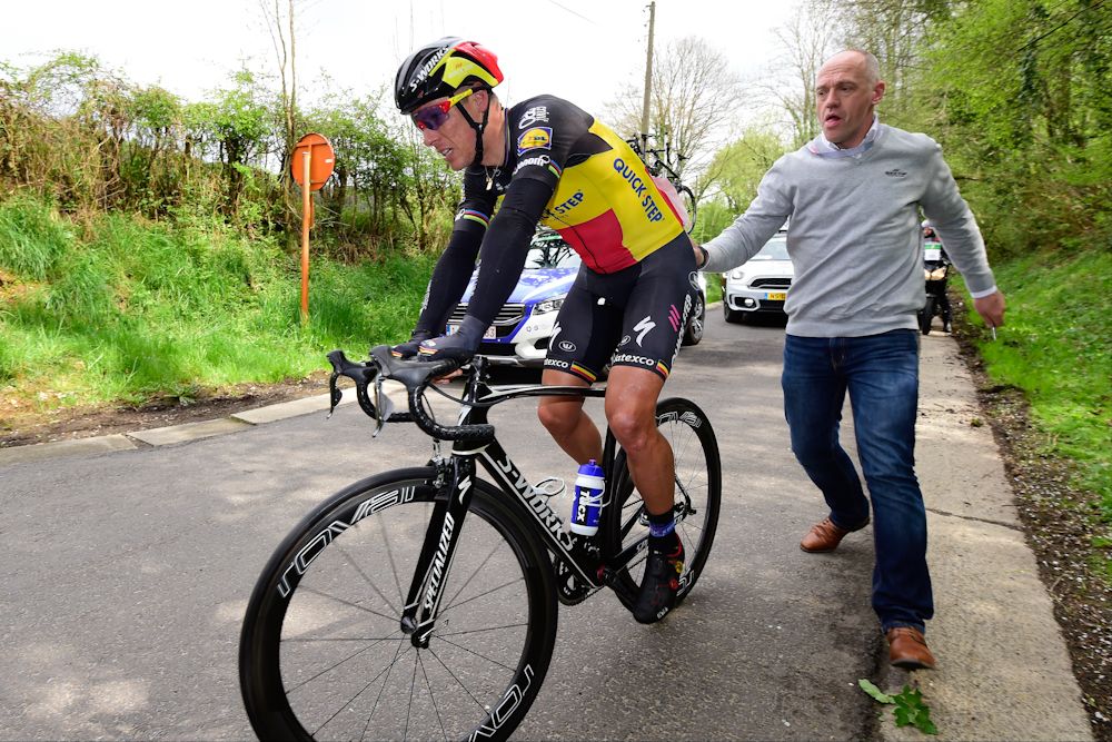 Philippe Gilbert gets a push to get going after crashing about halfway through the Amstel Gold Race