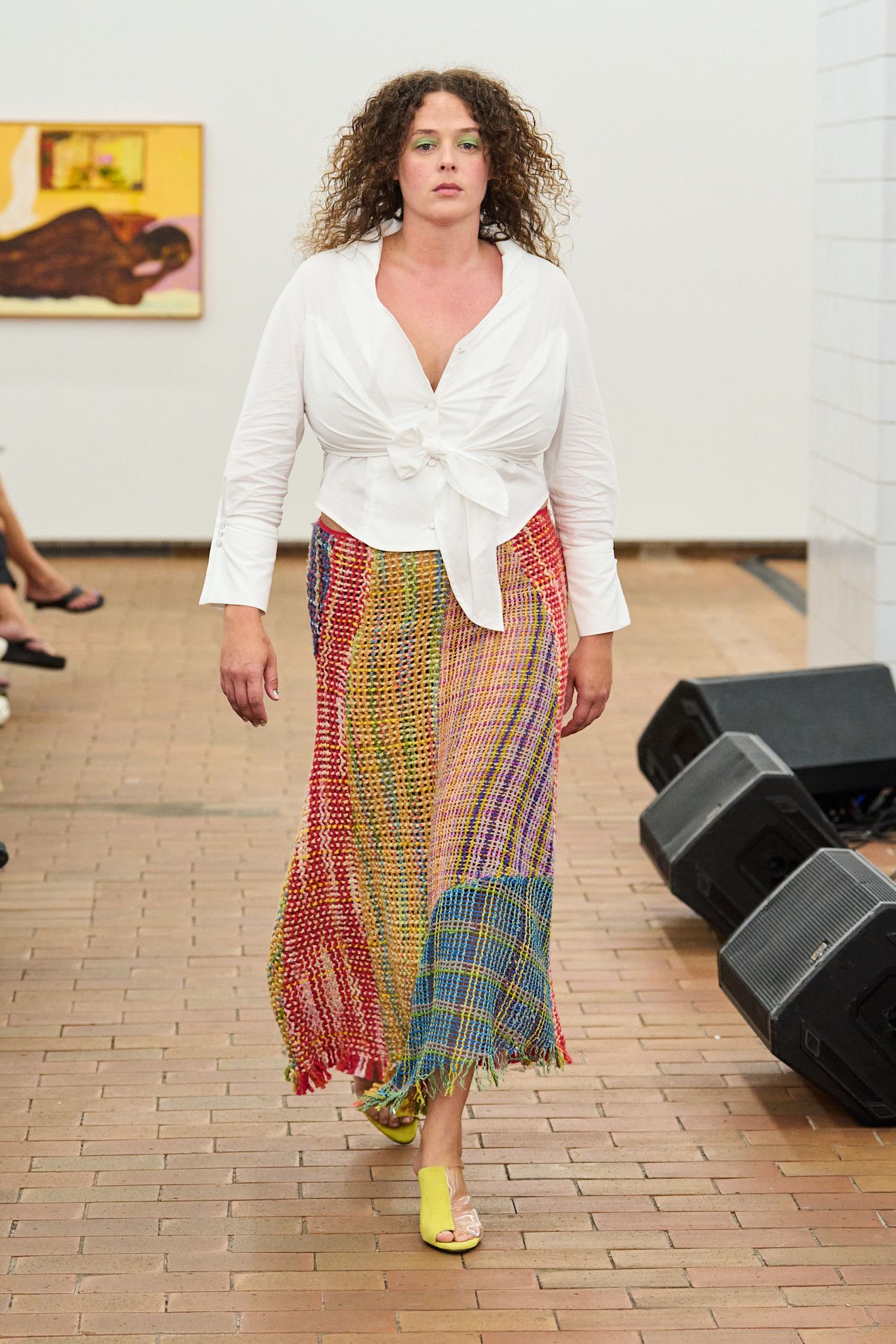 Four Spring 2027 Copenhagen Fashion Week looks featuring colorful woven skirts, white separates, layered gingham, and relaxed tailoring from Larkin, Skall Studio, and Nicklas Skovgaard.