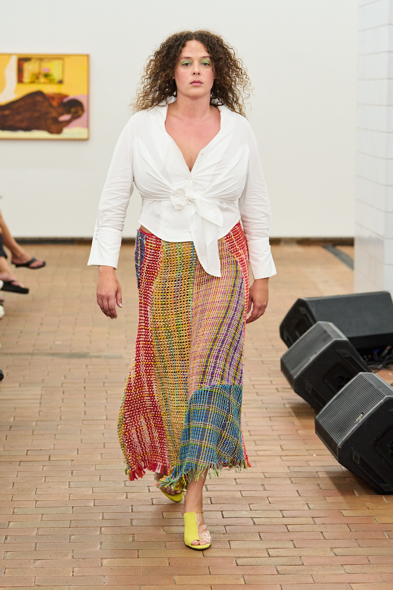 Four Spring 2027 Copenhagen Fashion Week looks featuring colorful woven skirts, white separates, layered gingham, and relaxed tailoring from Larkin, Skall Studio, and Nicklas Skovgaard.