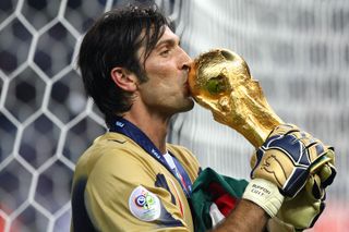 Gianluigi Buffon kisses the World Cup trophy after Italy's win in 2006.