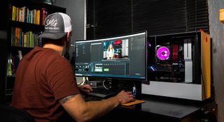 man editing video on a pc