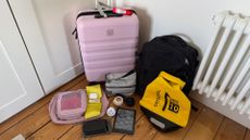 Selection of travel items, including suitcase, dry bag, packing cubes and more