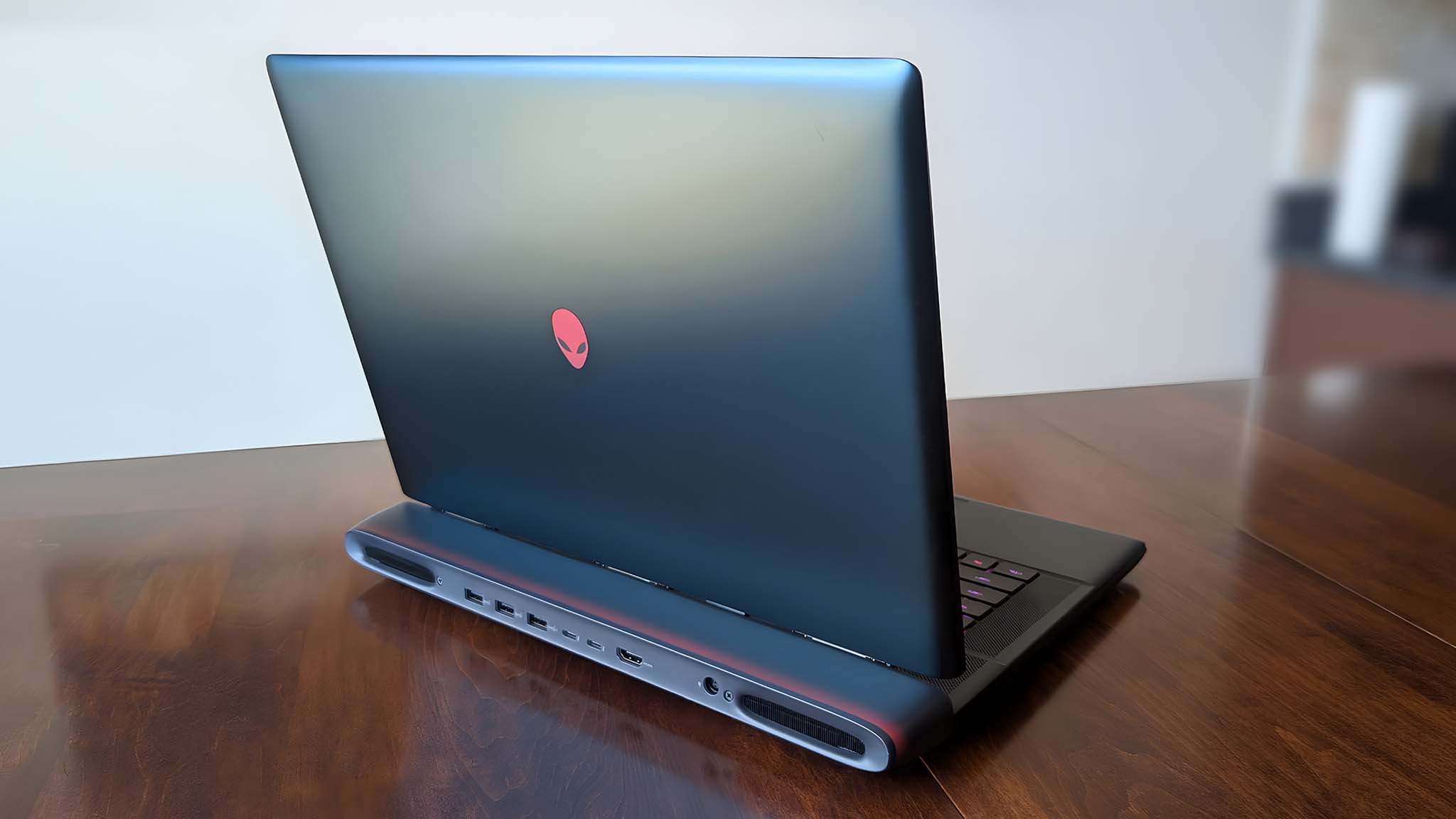 Back side of the Alienware Area-51 laptop while it sits on a table.
