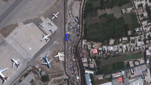 Crowds converge near Abbey Gate at Hamid Karzai International Airport in Kabul, Afghanistan, in this satellite image taken on Aug. 24, 2021.