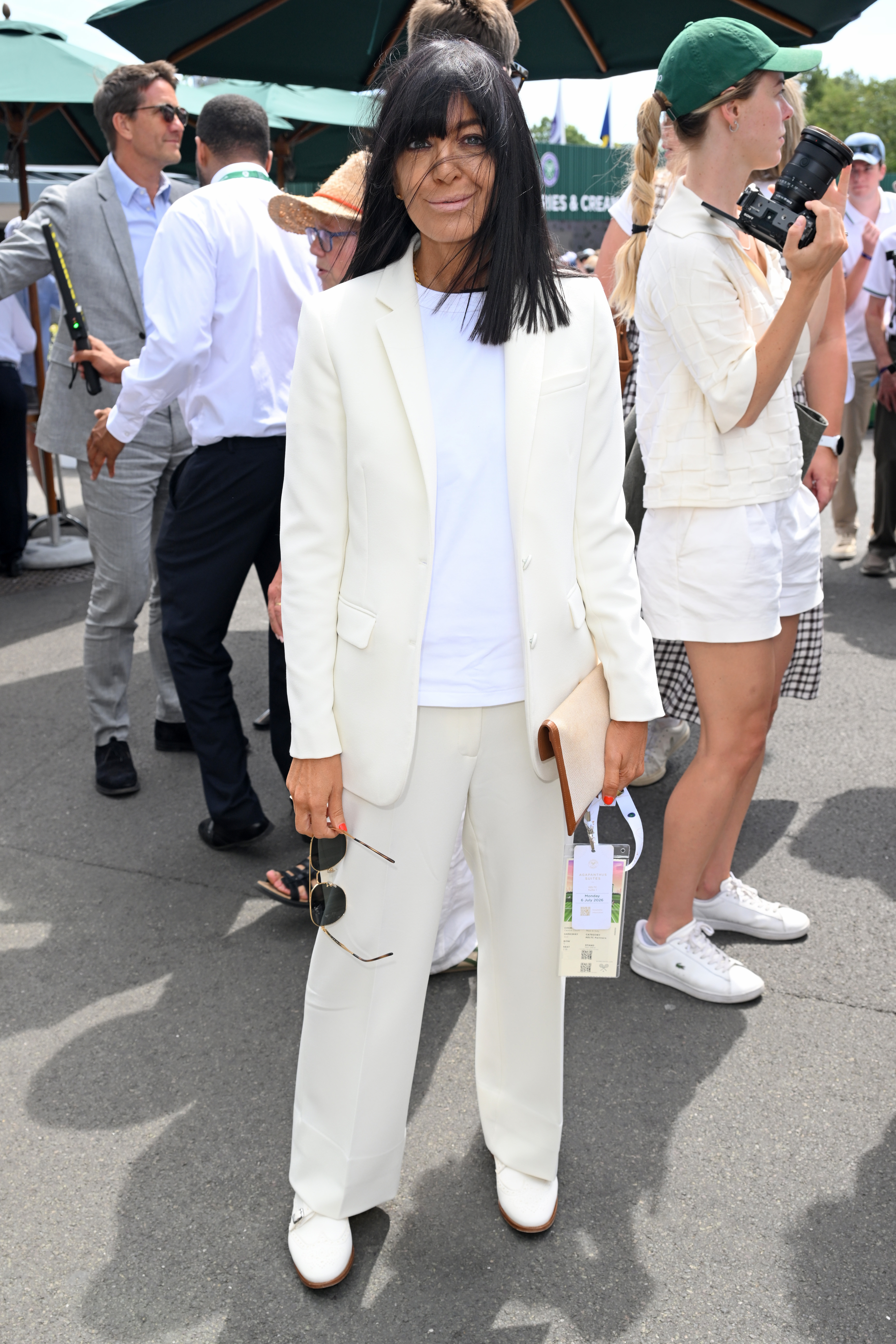 An image of Claudia Winkleman wearing the jazz shoe trend to Wimbledon in 2026.