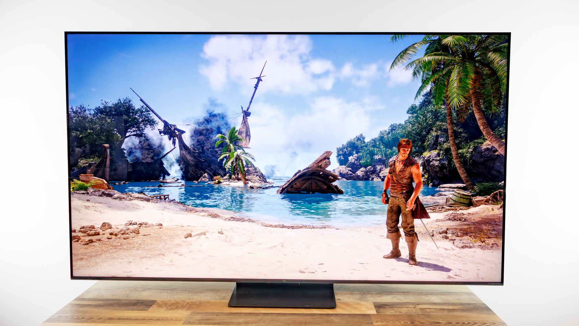 TCL QM7L 75-inch TV on a desk