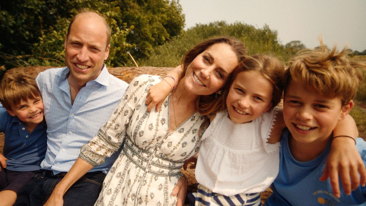 Kate Middleton poses with husband Prince William and their three smiling children Prince George, Princess Charlotte, and Prince Louis