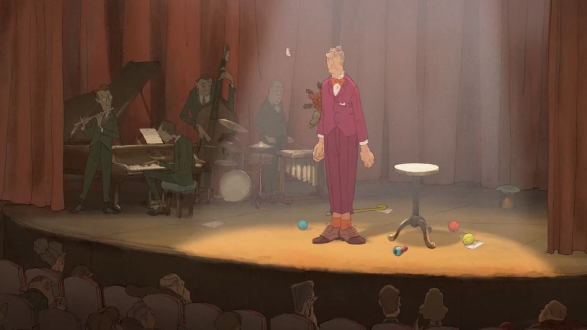 A magician stands on stage in The Illusionist