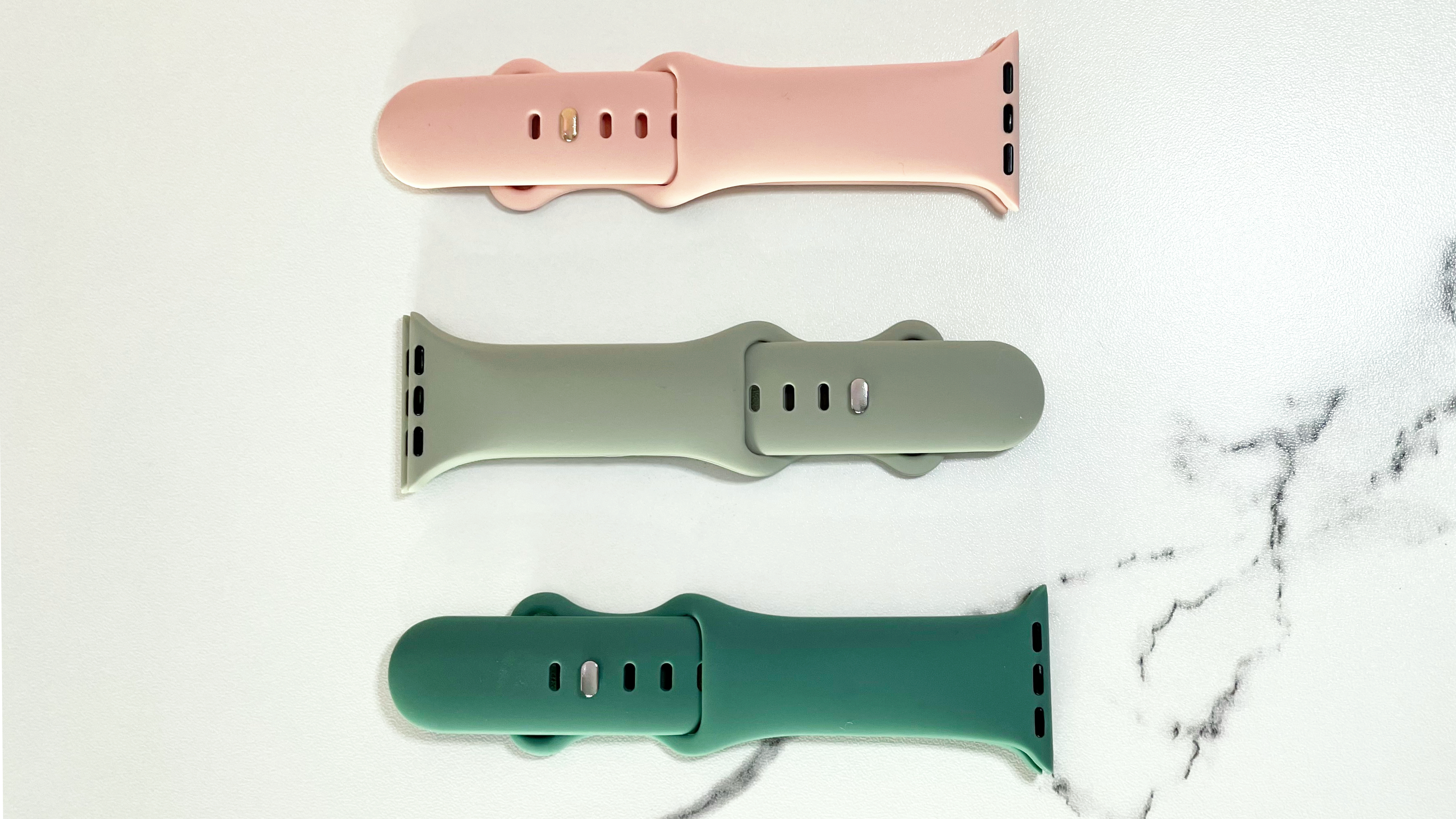 Three different coloured CeMiKa Silicone Sports Straps.