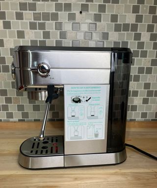 Casabrews espresso maker with instructions on how to make an espresso