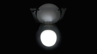 Toilet glowing and emitting light in the bathroom - stock photo