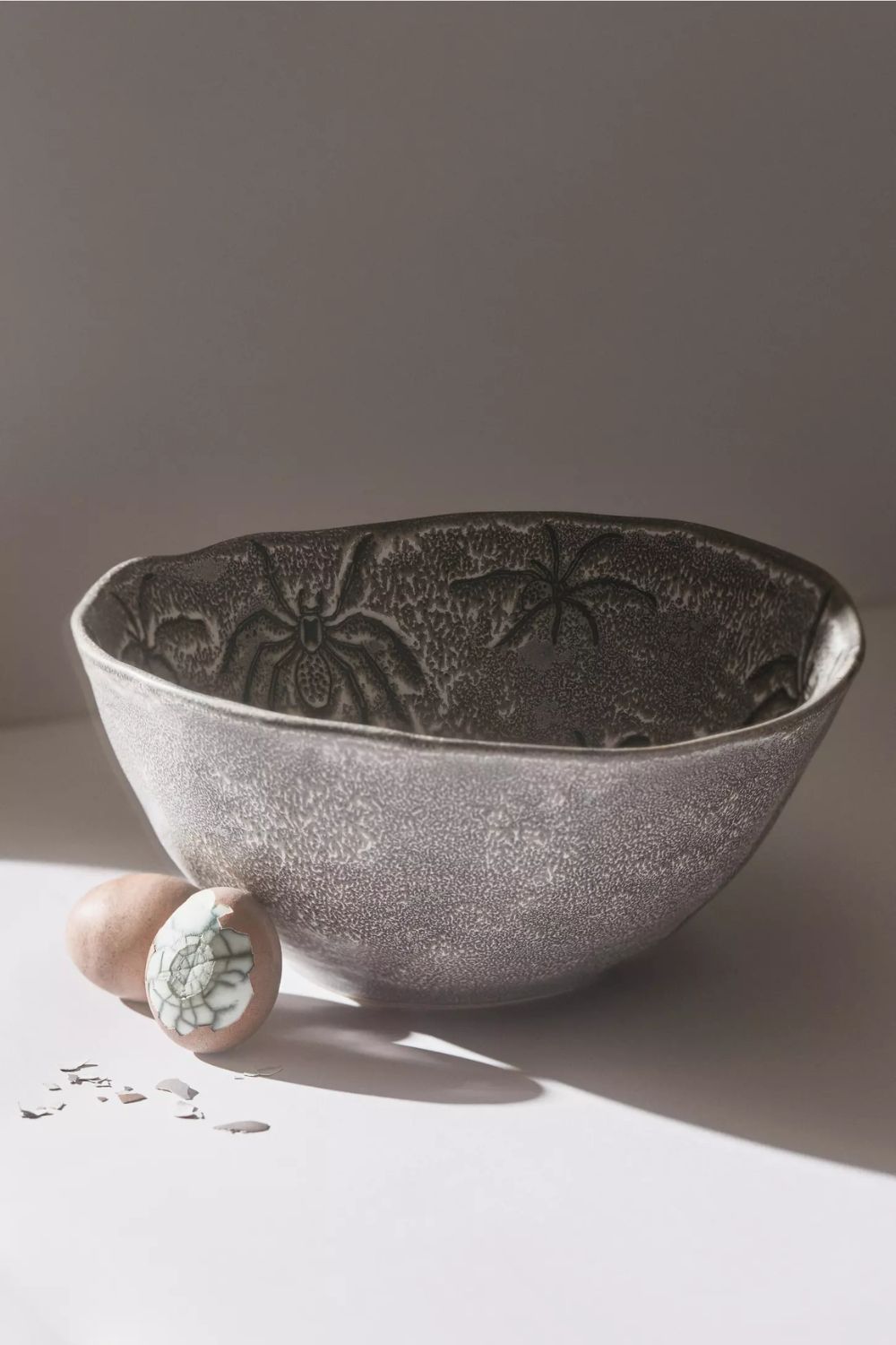 Gray stoneware bowl with spider motif
