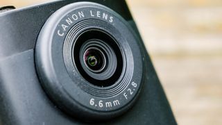 A black Canon PowerShot V10 vlogging camera