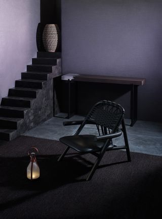 Natural Earth’ rug in black Bell’ lamp ‘Dala’ planter ‘Graft’ console and Unam’ lounge chair