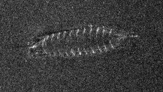 This sonar image from the autonomous underwater vehicle shows the distinctive shape of the wooden frame of a clinker-built vessel. 