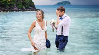 Newly weds walk out of the sea Stranded on Honeymoon Island.