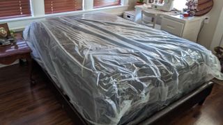 The Beautyrest Black K-Class Plush Pillow Top mattress in its plastic wrapping