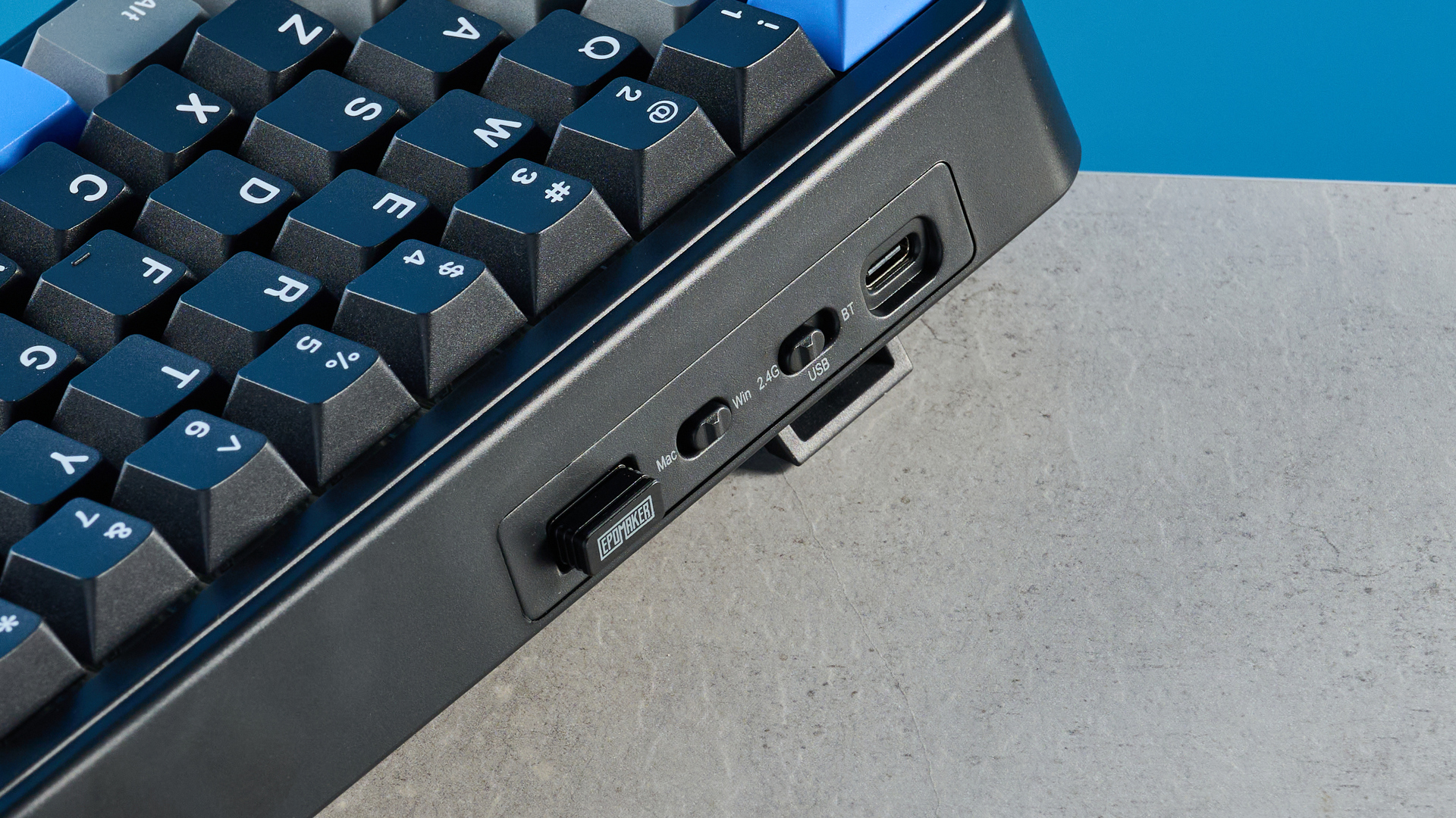 A black, gray and blue Epomaker HE65 Mag magnetic keyboard with Hall Effect switches