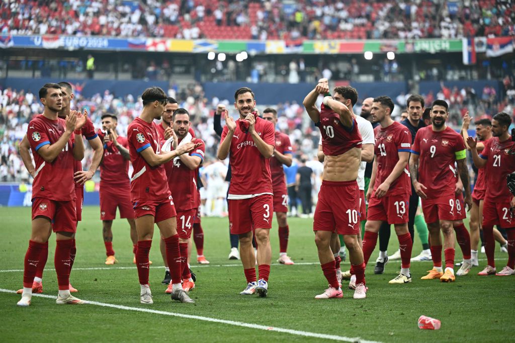 Serbia&#039;s midfielder #19 Lazar Samardzic, Serbia&#039;s midfielder #06 Nemanja Gudelj, Serbia&#039;s forward #11 Filip Kostic, Serbia&#039;s forward #14 Andrija Zivkovic, Serbia&#039;s defender #03 Nemanja Stojic, Serbia&#039;s defender #13 Milos Veljkovic, Serbia&#039;s forward #09 Aleksandar Mitrovic, Serbia&#039;s defender #25 Filip Mladenovic and Serbia&#039;s midfielder #21 Mijat Gacinovic celebrate with supporters after the UEFA Euro 2024 Group C football match between Slovenia and Serbia at the Munich Football Arena in Munich, southern Germany, on June 20, 2024.