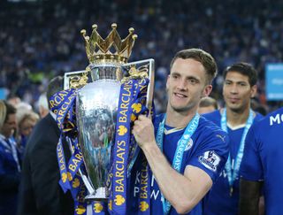 Leicester City's Andy King holds the Premier League trophy, 2016