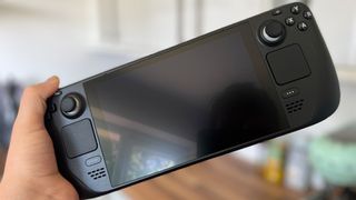 Best Handheld Gaming Devices 2024 - Steam Deck with the screen off in our hands