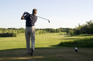 man on a golf course under tier 3 restrictions