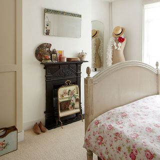 bedroom with white wall and fire place