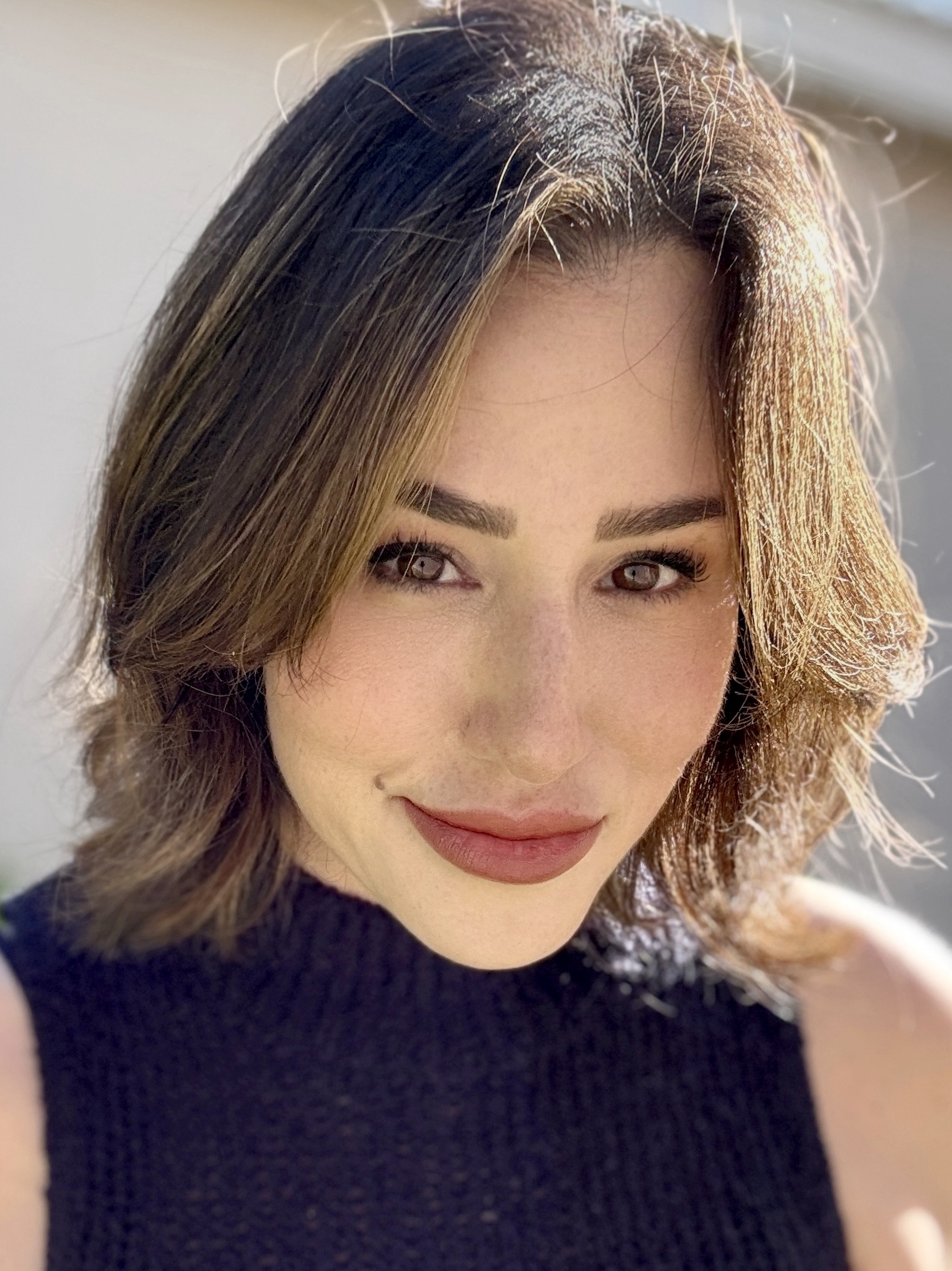 a white woman with brown hair and red lipstick