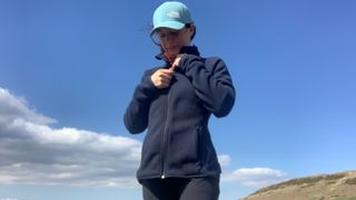 Julia Clarke hiking in the Helly Hansen Varde 2.0 fleece