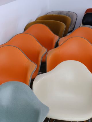 Eames chairs in orange, white and grey
