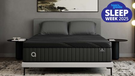 The Amerisleep AS6 mattress on a white bedframe