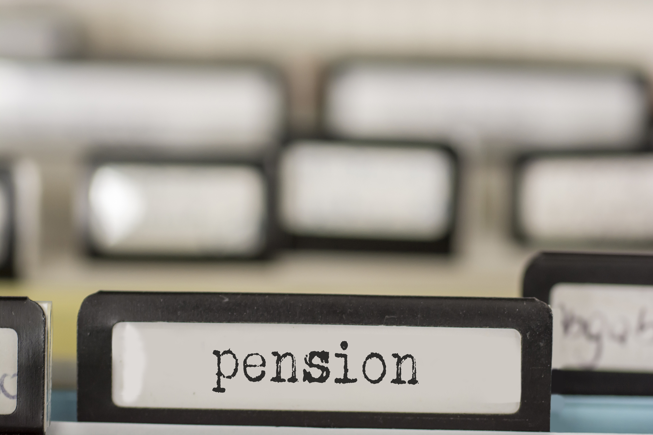 With typewriter written tabs on the subject of pension