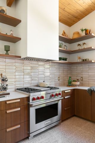 Retro mid-century modern kitchen with terrazzo flooring and wooden cabinets