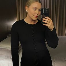 Woman wears black cardigan