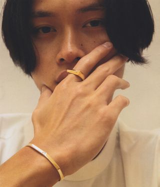 Man wearing ring and bracelet