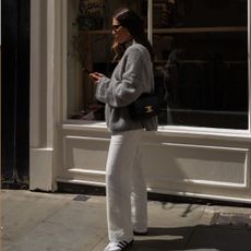 An image of @_jessicaskye wearing white sneakers.