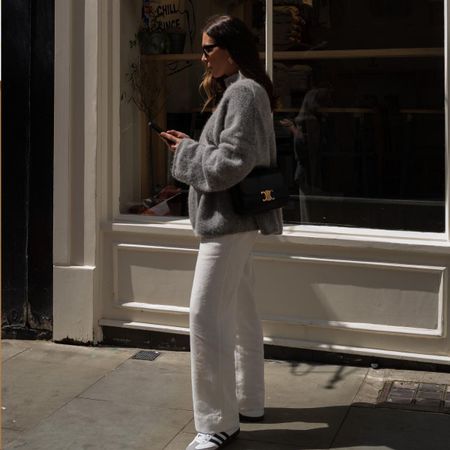 An image of @_jessicaskye wearing white sneakers.