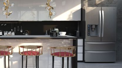 A black and stainless steal kitchen with a large double door fridge in the corner, an island with red seated bar stools 