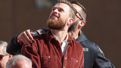 Harrison Butker looks up at the crowds during the Kansas City Chiefs Super Bowl LVIII Victory Parade on Feb 14, 2024 in Kansas City, MO. (Photo by Scott Winters/Icon Sportswire via Getty Images)