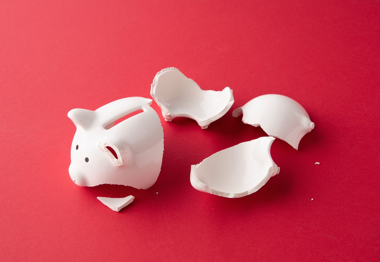 Retirees pension pots with red background and broken piggy