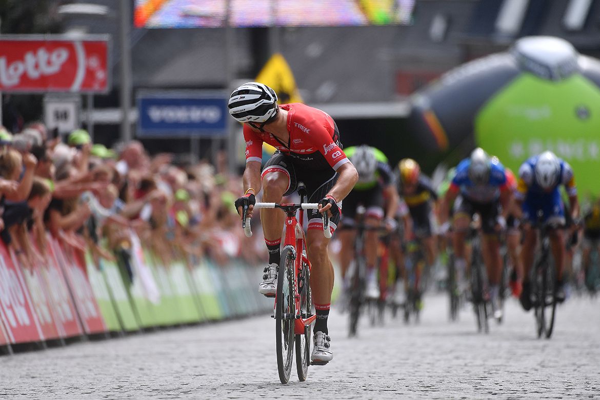 Jasper Stuyven looks over his shoulder to see where the chasers are